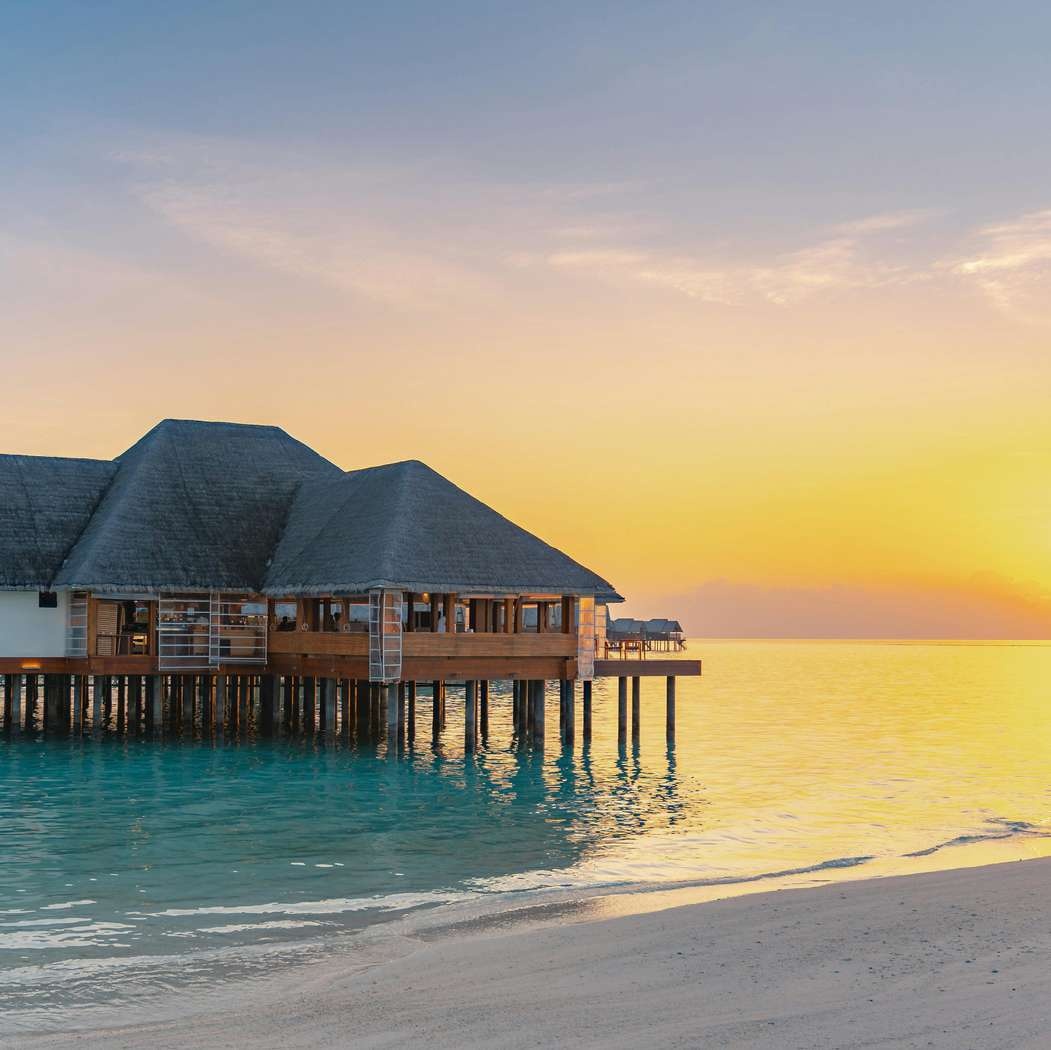 Aerial view of overwater villas at a Maldives resort